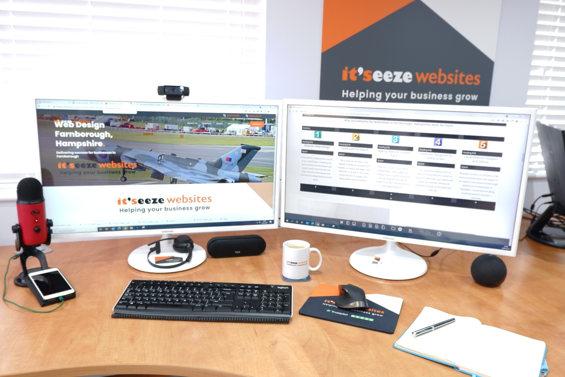 Two computer screens displaying the it'seeze website